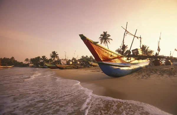 depositphotos 111218830 stock photo dhoni fishingboats at the coast